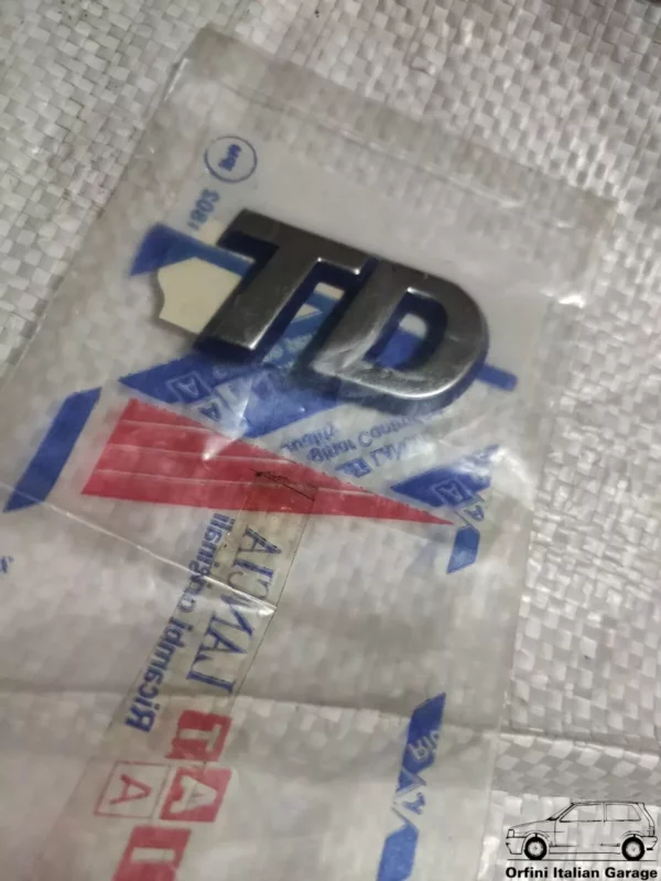 7795235 Fiat Punto TD Side Badge View Front