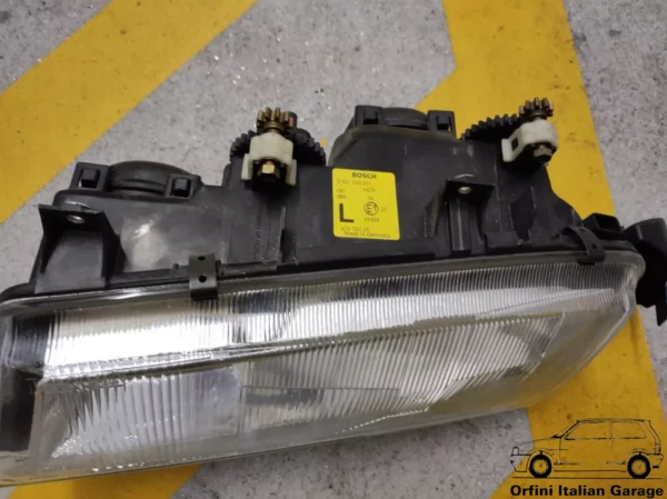 82475333 Front Left Bosch Headlight - Lancia Delta MK2 836 View Rear
