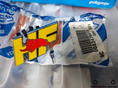 11315-82476419-1.webp 82476419 Front Grill Badge Scritta Lancia Delta HF