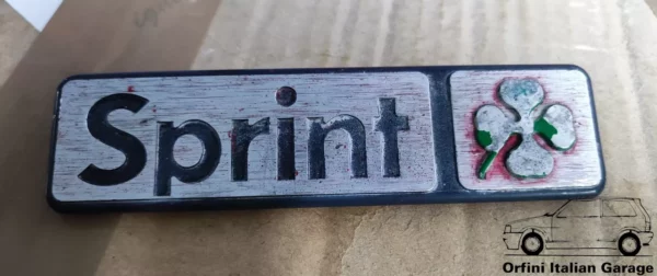 11443-60523864-1.webp 60523864 Rear Badge Scritta Alfa Romeo Alfasud Sprint Quadrifoglio