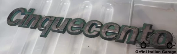 7747245  Rear Badge Scritta Fiat Cinquecento