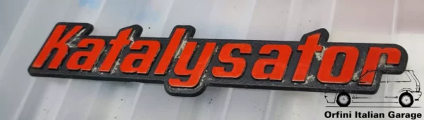 12107-Emblema-Katalysator-Opel-VW-Audi-Skoda.webp Rear Badge Katalysator Opel VW Audi Skoda