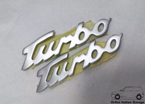 12705-46305661.webp 46305661 Pair Side Badge Scritta Turbo Fiat Coupe 20V Turbo